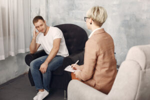 man-sitting-psychologist-s-office-talking-about-problems